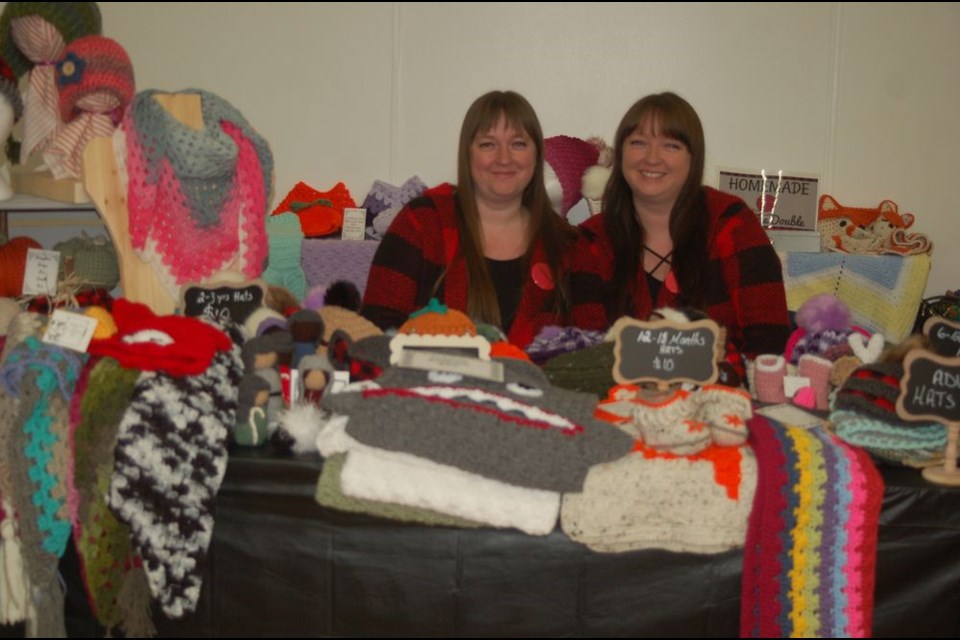 Tracy Lagrove, right, and her twin sister Trisha Remple had crocheted items on display on October 6 at the Preeceville October trade show.