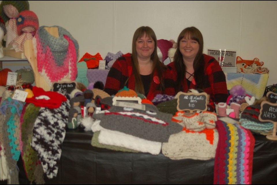 Tracy Lagrove, right, and her twin sister Trisha Remple had crocheted items on display on October 6 at the Preeceville October trade show.