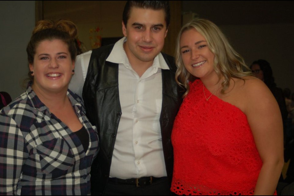 Aaron Prociuk of A. R Cash, the Johnny Cash tribute band visited with many of the concert goers on October 12 in Preeceville. From left, were: Nicole Bileski, Prociuk and Brooke Huska.