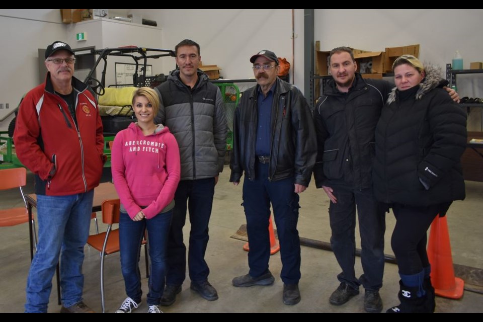 Members of the Kamsack Volunteer Fire Department who were at the fire hall on October 13 to demonstrate the firefighting equipment during an open house, from left, were: Bruce Thomsen (captain), Kristin Johnson, Wayne Snyder, Ken Thompson (acting fire chief), and gave information to Trevor Snyder (Wayne’s brother) and his wife Nadine Howardson who were visiting from Calgary.