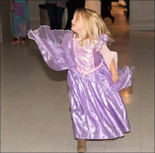 Breanna Rodness dances to music on the dance floor.