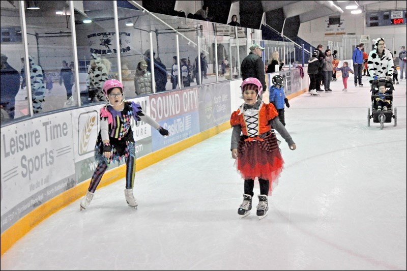 Kids and their families had lots of fun at Battleford Arena Monday evening during Skate Battlefords' family Halloween skate. Many colourful costumes were on display. Photos by John Cairns