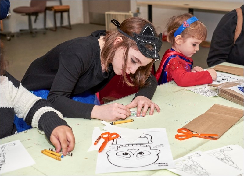 Participants colour puppets.