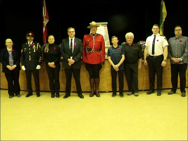 Borden Remembrance Day service wreath layers were, left to right, Gayle Wensley, minister, Sgt. Aaron Piprell, Mary Hunchak, Jamie Brandrick, Cst. Gary Pepin, Bill Hosegood, Ron Saunders, Luke Walker and Tom Redhead. Photos submitted by Lorraine Olinyk