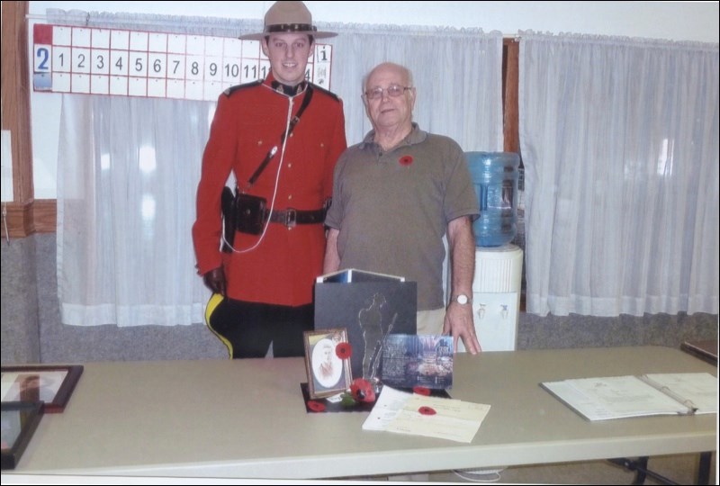 Constable Mike MacFarlane and Arthur (Woody) Lacey stand behind the display of the statue There But Not There commemorating the fighting at Vimy Ridge. Woody’s father, Arthur G. Lacey, was a Vimy Ridge veteran. Photos submitted