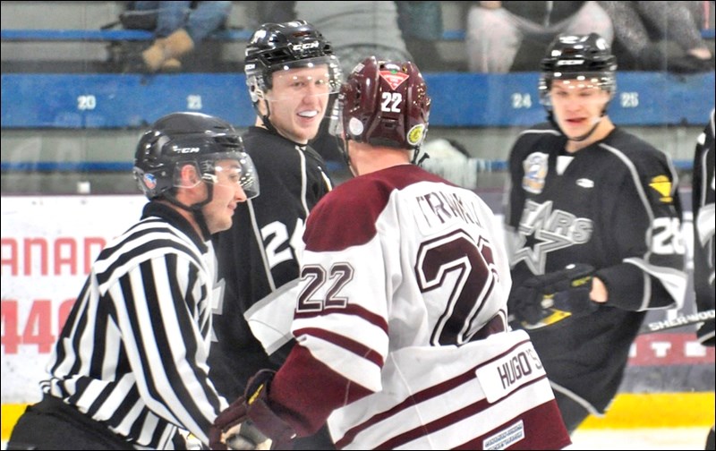 North Star Kaden Boser laughs at Caleb Franklin’s jokes in the third period Friday night. The North Stars were all smiles as they beat the Bombers 3-1.