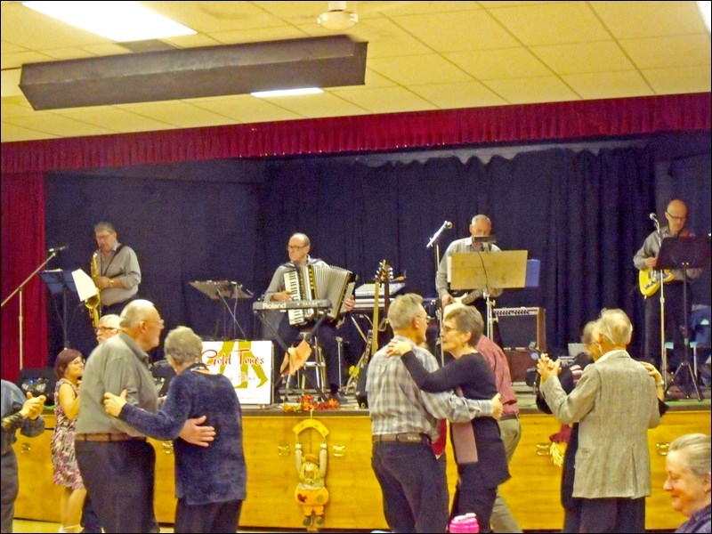 Dancers with Goldtones on stage at Borden’s Nov. 17 supper and show. Band members are Oliver Siba, Ron Tanchak, Russ Fountain and John Chipak.