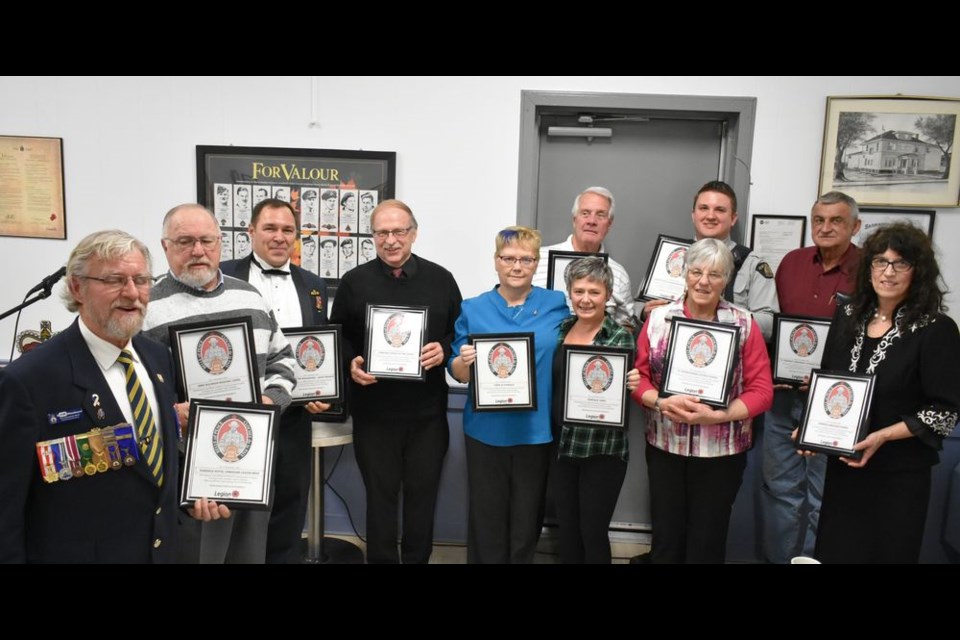 Nineteen groups and individuals were presented with framed certificates to acknowledge participation in the 100 Bells of Peace initiative to honour the 100th anniversary of the end of the First World War. Those available for the photo, from left, were: (back) Rod Gardner, Kamsack United Church; Cst. Ryan Nicholson, Kamsack RCMP; Alvin Harambura, St. Josephat’s Ukrainian Catholic Church; (middle) Major Tim Woodward, guest speaker; Rev. Stephen Ruten, Evangelical Free Church; Mayor Nancy Brunt, Town of Kamsack; Becki Patterson, air cadets; Loraine Thomas, St. Stephen’s Roman Catholic Church, and Milena Hollett, Hiawatha Chapter of the Easter Star, and (front) Jim Woodward, Kamsack Legion, and Rick Aikman, Kamsack Masonic Lodge.