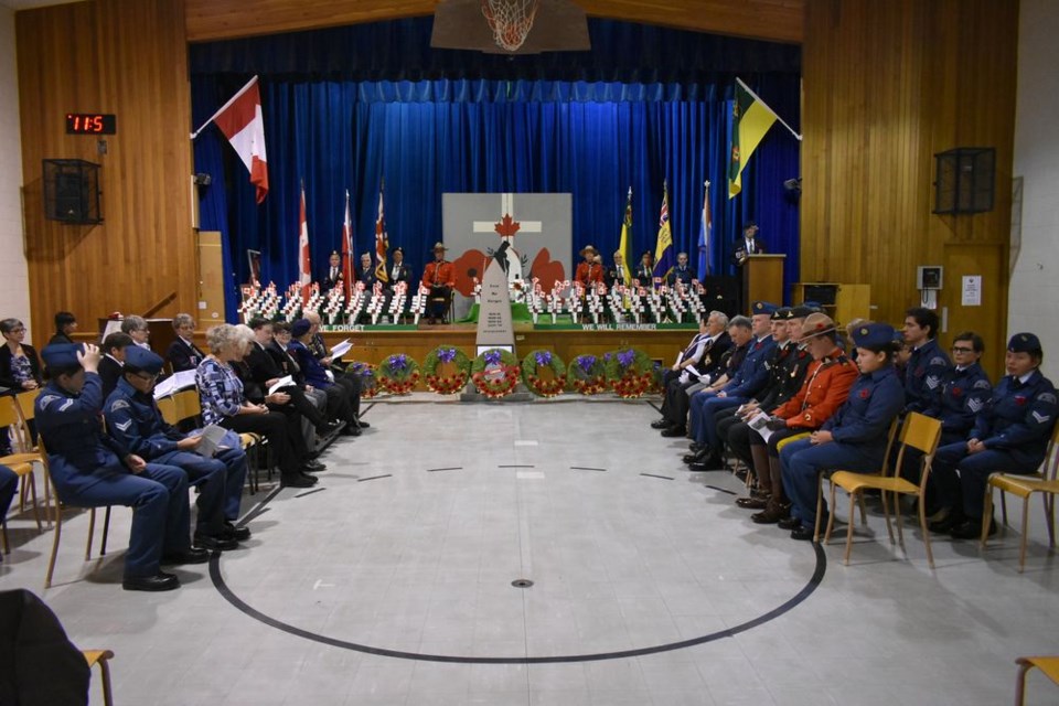 An on-stage cenotaph was erected for the Remembrance Day service held at the Victoria School on November 11, and 49 wreaths were placed by individuals and groups to honour veterans.