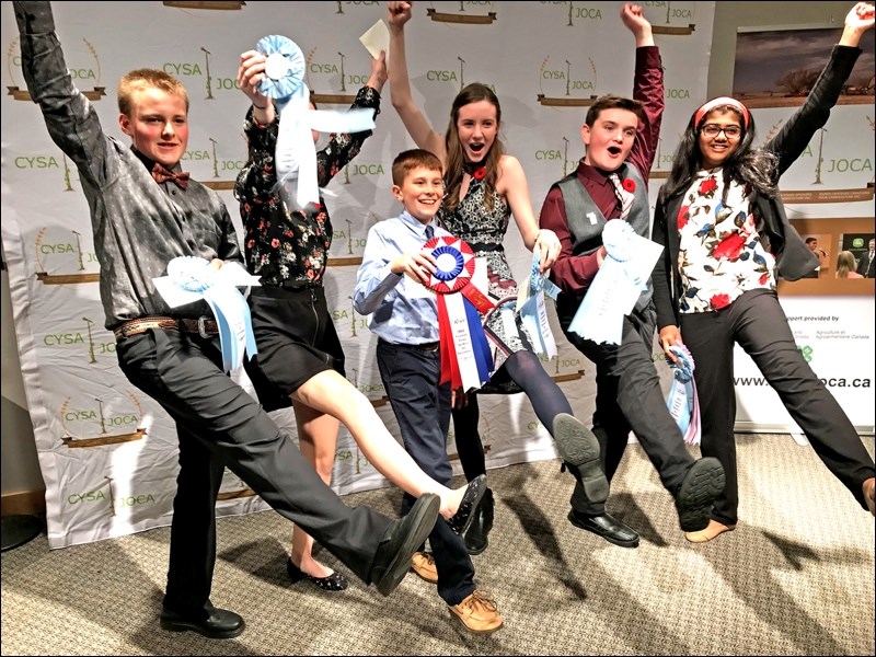 Hunter Reid (left) from Hafford placed third in the junior age group at the 34th National Canadian Young Speakers for Agriculture competition at the Royal Agricultural Winter Fair.