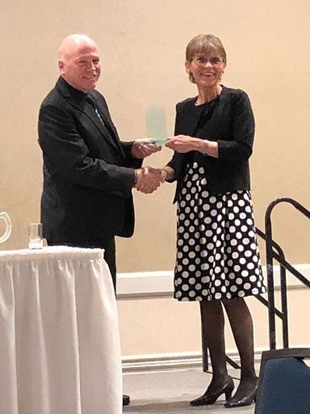 Jerry Lisitza of Preeceville, left, received the Saskatchewan Music Education Association honorary life time member award from Celia Hammerton, president of the Saskatchewan Music Education Association at an awards evening held at the Saskatoon Inn on November 16.