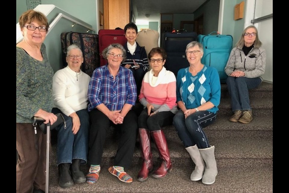 Klothes for Kids volunteers were responsible for filling suitcases with blankets and quilts that will donated to an orphanage/school overseas. From left, were: Sharon Musey, Heather Godlien, Barbara Duke, Norma Appel, Carole Hauber, Joanne Barber and Beth Hubbard. Unavailable for the photograph were: Aileen Lubiniecki, Anita Desroches, Barb Bicum, Laurie Decker, JoAnn Lubiniecki, Esther Musqua and Shirley Woytas.