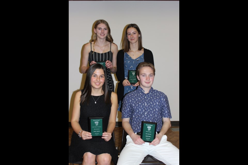 Most Improved/Player of the Future award winners were: back row, Carley Ostafie, Camryn Danchilla. Front row, Hailey Madsen, Caleb Hove. Missing; Brady Gelowitz, and Levgen Lavrentiev.