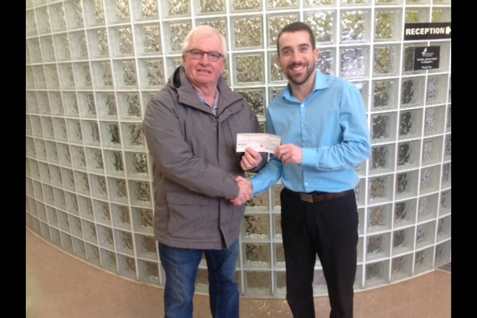 Yorkton Antique Auto Association president Ron Blommaert presented a cheque in the amount $500.00 to Brendan Wagner of the Parkland Community College for their scholarship program.