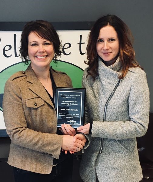 Nicole Korpusik, left, of Norquay was presented with a Garden of Saskatchewan (GOS) plaque by nominator Jaime Johnson of Norquay.