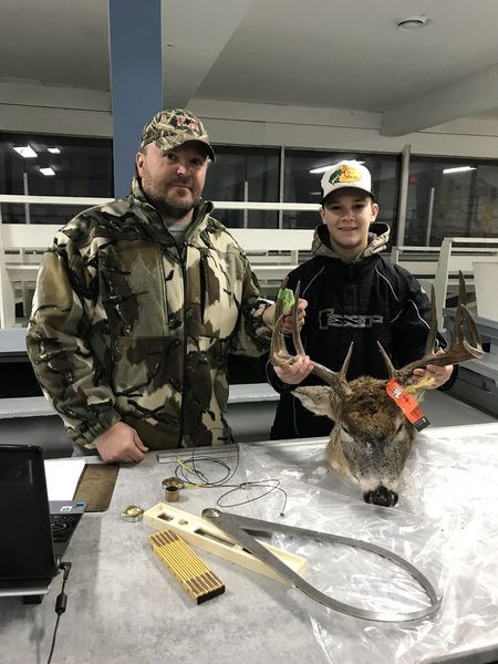 Blair Mitchell, left, scored a set of deer antlers brought in by Kaiden Masley.