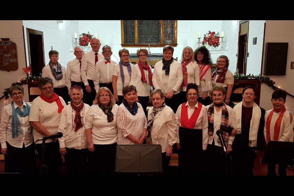 The Kamsack Community Choir held its annual Christmas concert on December 10 at the United Church. Members of the choir, from left, were: (back) Audrey Girling, Al Makowsky, John Adamyk, Bruno Lemire, Arlene Smorodin, Audrey Horkoff, Dieneke Spronk (vocals and flute), Deb Sears, Milena Hollett and Zennovia Duch and (front) Susan Bear (choir director), Florence Bielecki, Melva Armstrong, Kathie Galye, Barb Lang, Diane Larson, Deanne Lemire, Mary Welykholowa, Ashly Hollett and Deb Cottenie (pianist.)