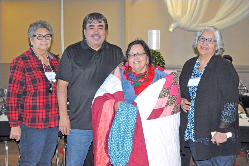 A special presentation was also made to Kerry Sasakamoose, director of training and employment, for her work in that area over the past year. Presenting to Sasakamoose was Chief Larry Ahenakew of Ahtahkakoop, Eliza Sasakamoose and Chief Sylvia Weenie of Stoney Knoll Cree Nation.