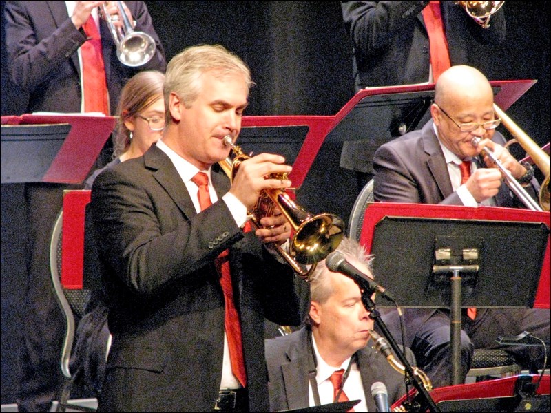 Saskatoon Jazz Orchestra Artistic Director Dean McNeill performs a solo. The award winning Canadian trumpet player/composer regularly performs in both the classical and jazz idioms. Dean has been a University of Saskatchewan Dept. of Music faculty member for the past 19 years over which time he has performed and adjudicating throughout Canada and the United States.