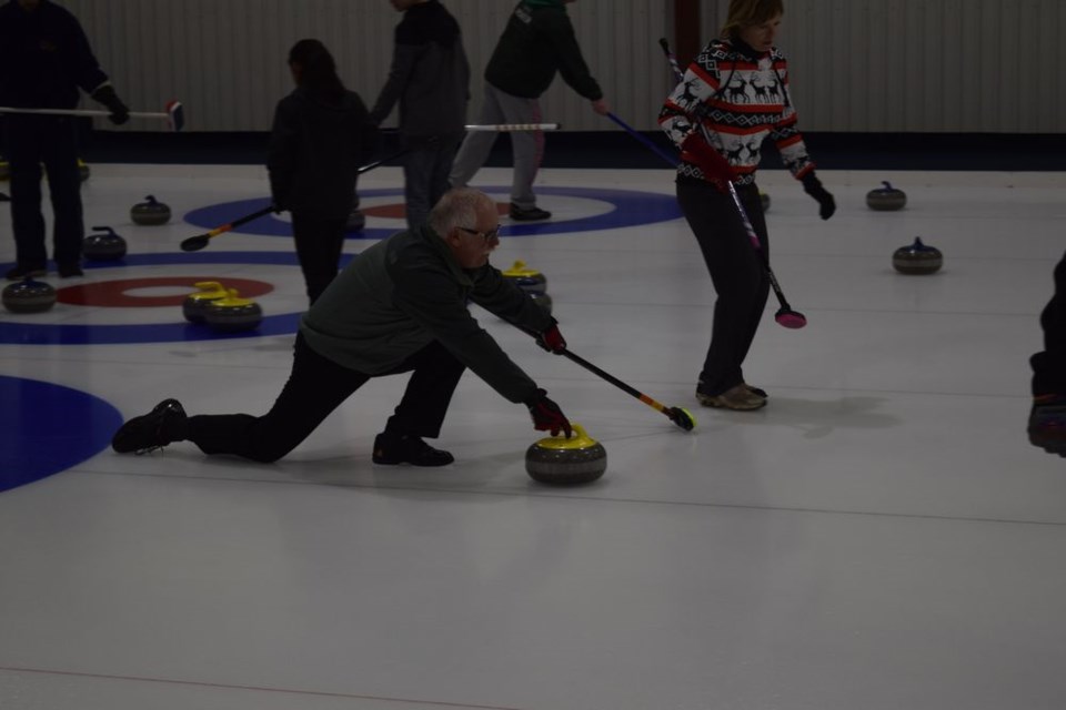 Kevin Coleridge of Good Spirit Lake delivered a rock during the Christmas bonspiel.