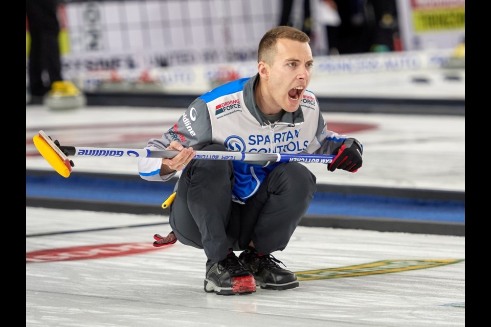 Brendan Bottcher, skip for Team Bottcher, calls for team mates to sweep harder.