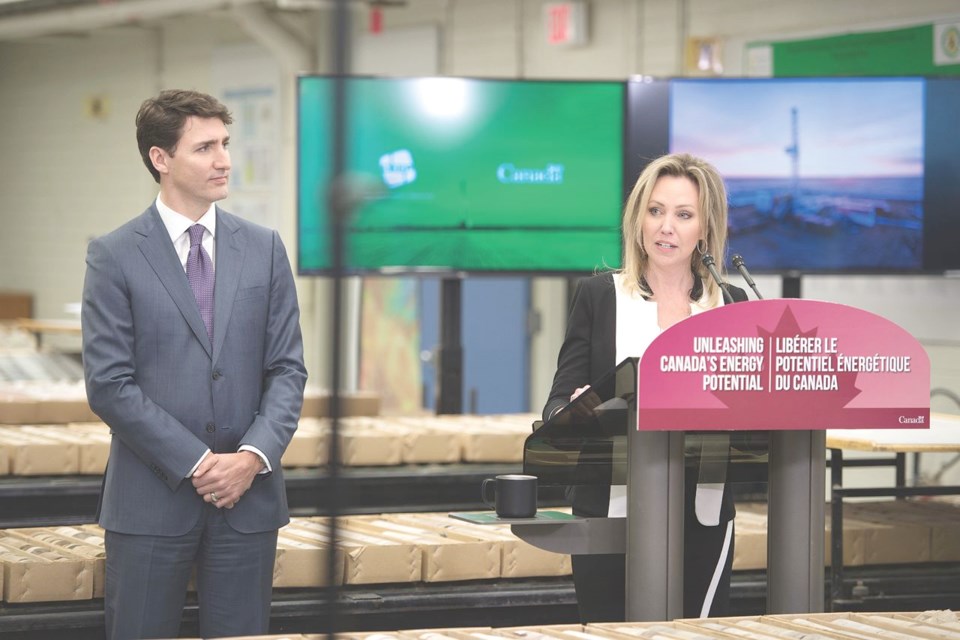 Prime Minister Justin Trudeau, left, complimented Kirsten Marcia for being a clean-energy trailblazer as he announced $25.6 million in federal funding for the Deep Earth Energy Production Corp. project. Photo by Brian Zinchuk