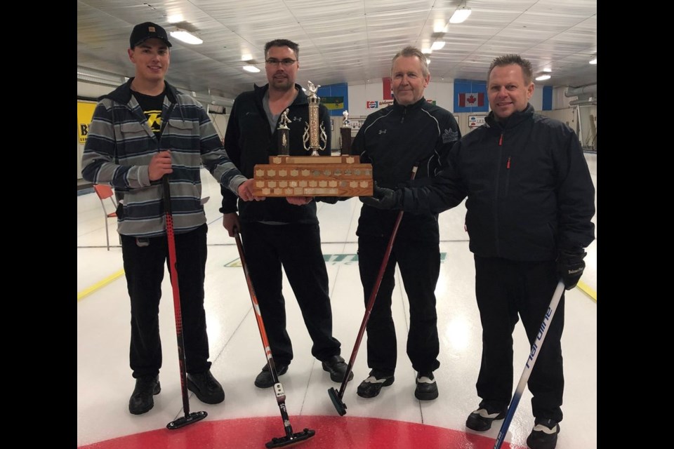 Fred Perepiolkin, right, and his curling team, from left, of Connor Bodnaryk, Nolan Nykolaishen and Glen Becenko played very well in Kamsack on January 11 to win the Duck Mountain Super League (DMSL) trophy. Photo courtesy of Patty Kolodziejski.