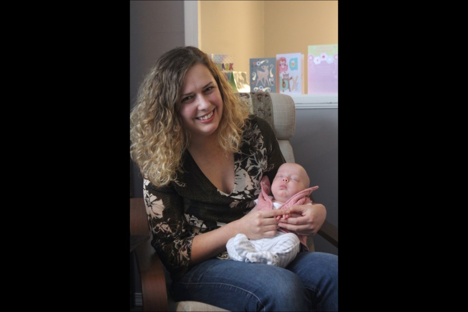 Noelle Drimmie and daughter Daisy Spencer in their home in Flin Flon. Daisy was born on Sept. 25 at 28 weeks, more than two months premature. - PHOTO BY ERIC WESTHAVER