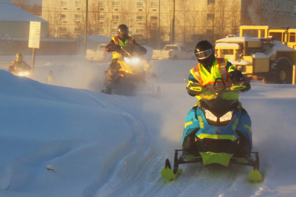 GO Snowmobiler Brad Cox from Swan River makes his way down the trail near Flinty’s Campground to kick off the Lions’ Journey for Sight on Jan. 16. The group of about two dozen snowmobilers headed south to Cranberry Portage, led by Flin Flon Lions Andy and Melissa Wasylciw, before reaching Brandon on Jan. 21. The ride raises money for the Lions Eye Bank program. - PHOTO BY ERIC WESTHAVER