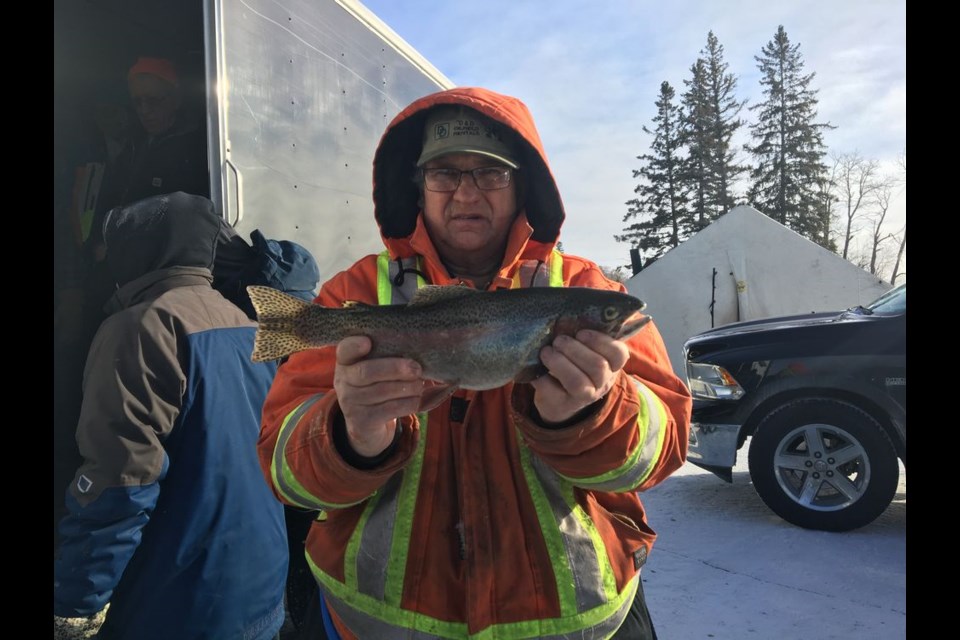 John Masko of Preeceville won first place in the Lady Lake fishing derby with his 45 cm Rainbow Trout that he caught during the derby, held despite -35 degree temperatures on January 20.