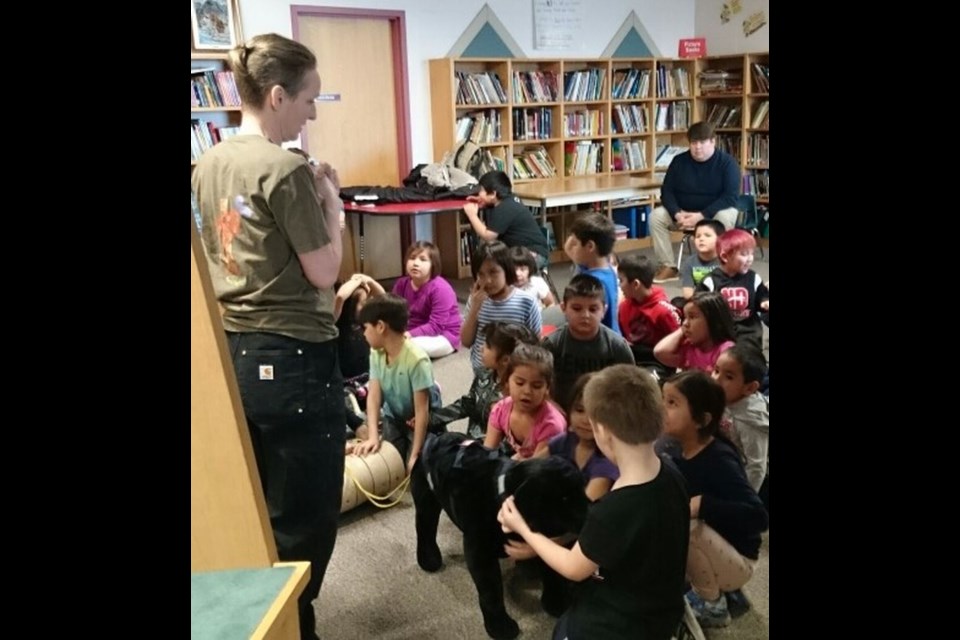 Kristi Benson, left front, a local dog training professional from San Clara, Man., was at CGCEC to give the students a presentation on dog safety with Petunia, a large toy stuffed black dog (on the floor in front.)