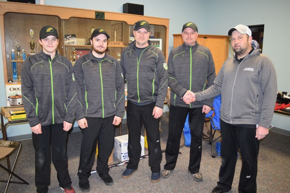 Team Zuravloff was the A event champion of the Canora Town and Country Bonspiel, held from January 23 to 27. From left, are: Lane Zuravloff (lead), Brandon Zuravloff (second), Rob Zuravloff (third) and Kent Zuravloff (skip), receiving congratulations from John Zbitniff (Canora Curling Club.)