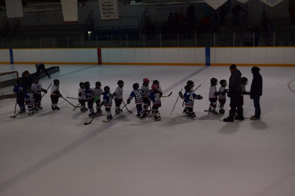 The Canora IP Cobras (white jerseys) and the Preeceville IP Pats shook hands after a spirited game to kick off Canora Minor Hockey Day on January 26.