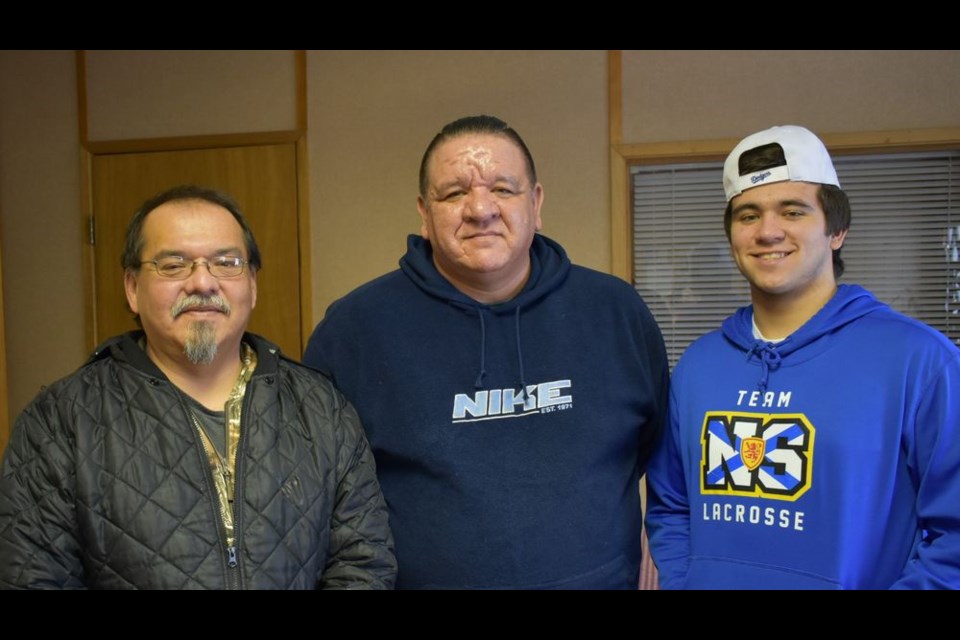 Dakota Morrisey, right, of Dartmouth, N.S., had the opportunity to visit the Keeseekoose Chief’s Education Centre (KCEC) on January 21, and give a presentation on the game of lacrosse. With him were Steve Morrisey (centre), his father and George Musqua, Steve’s cousin, of Keeseekoose First Nation.