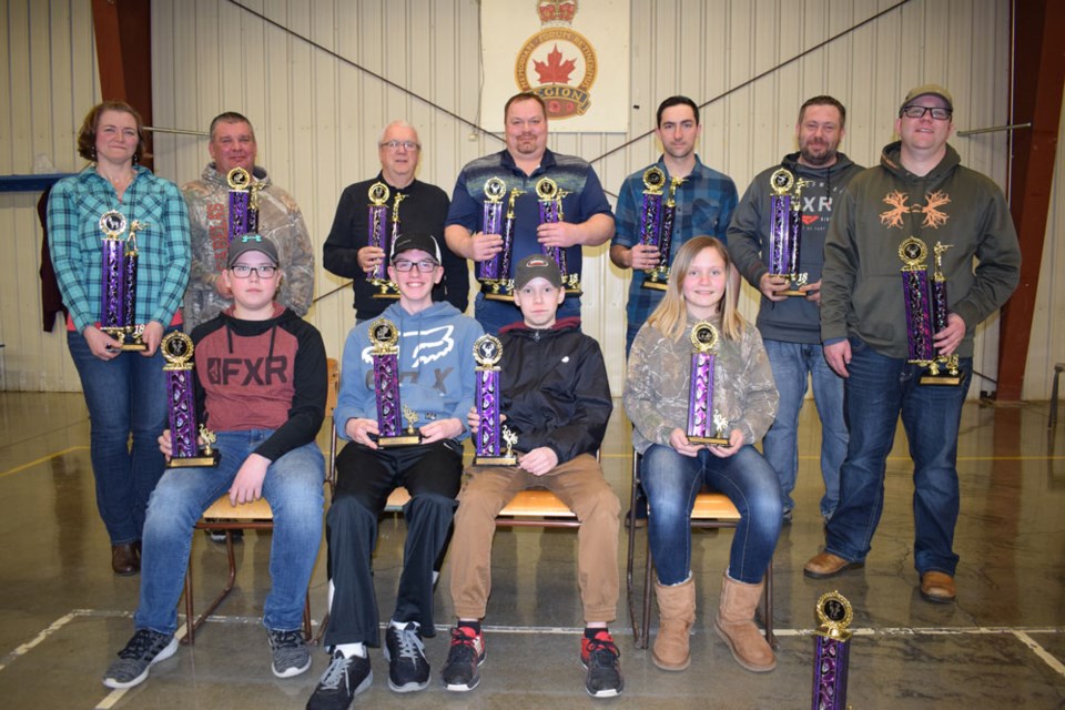 Trophy winners for big game rifle were, back row, from left, Carla Clark, Dave Clark, Jim Skuce, Sheldon Michael, Nate Smart, Kevin Thompson and Kyle Skuce. Front row, Braden Wallster, Cameron Sehn, Jayden Van de Woestyne and Krislyn Pylychaty.