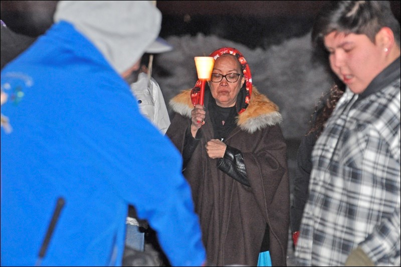 Debbie Baptiste holds a candle to commemorate her son Colten Boushie, who was killed in August 2016.