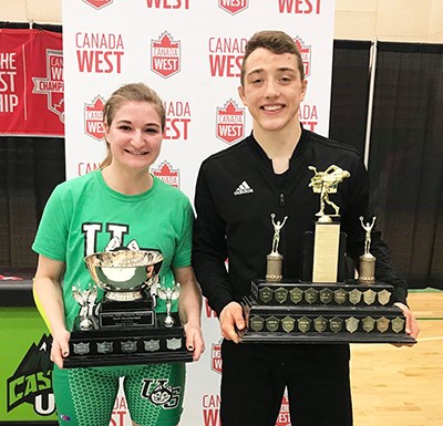 Angela Aalbers (left) and Nathen Schmidt got together for a photo with their respective team trophies, Aalbers is a member of the University of Saskatchewan team who won the Women’s Canada-West team title and Schmidt with his team title trophy.