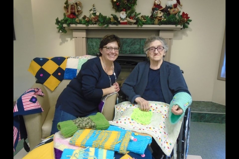 Cheryl Williams enjoys spending time with her mom Elsie Lewchuk at Gateway Lodge in Canora. Thanks to Williams, Gateway Lodge has been a recipient of a number of twiddle-muffs and lap mats, sensory stimulation items suitable for residents with dementia.
