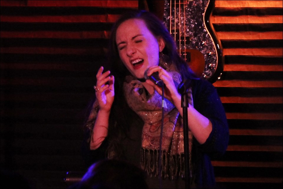 Janève Masson performs her song “Wonderland King” at Johnny’s Social Club during a Loaded Mic show on Jan. 12. Masson has entered the song, recorded that night at Johnny’s, in this year’s CBC Searchlight contest. - PHOTO BY ERIC WESTHAVER