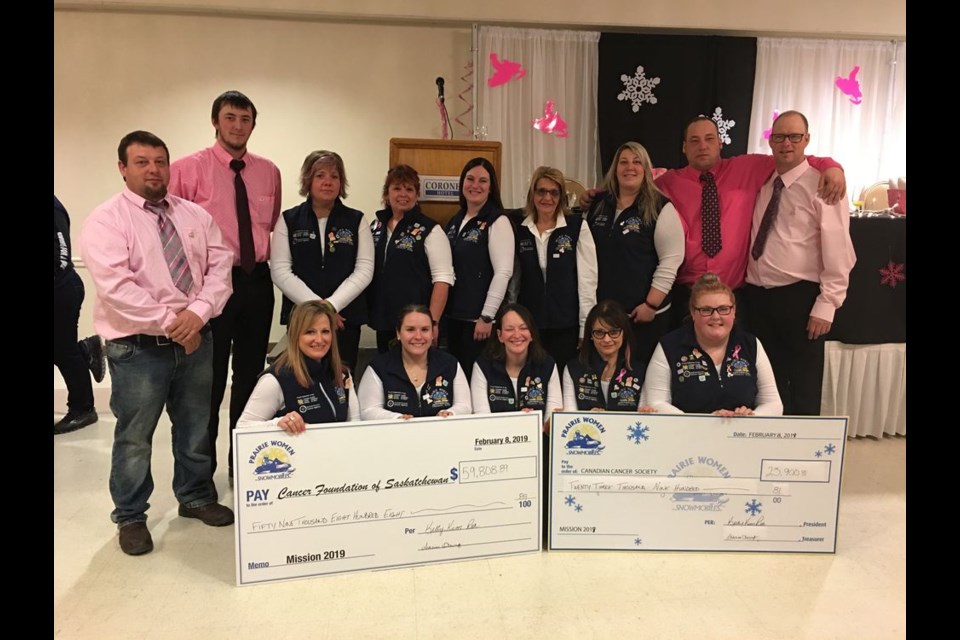The ten core riders for PWOS (Prairie Women on Snowmobiles) Mission 2019 were joined by members of the pit crew, who were dressed up in pink to celebrate the success of the event in raising over $83,000 for Canadian Cancer Society and the Saskatchewan Cancer Agency. From left, are: (standing) Clint Taylor, Wyatt Smith, Shauna Menzel, Janis Stanley, Kaylee Plamondon, Arlene Lockinger, Alison Taylor, John Lamon and Kelly Phinney, and (kneeling) Shawna Leson of Canora, Brittany Fox, Nadine Wiebe-Trapp, Kim Hladun of Canora and Brandi Kashuba of Preeceville.