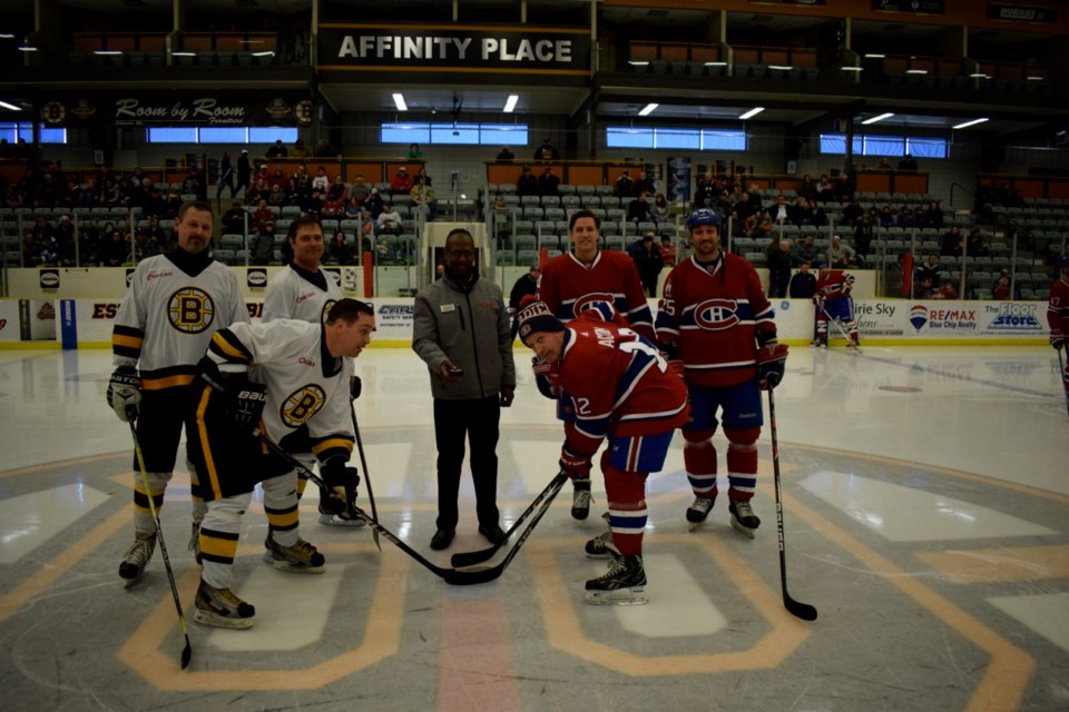 Brad Robinson, John Wells and Evan Handley from the OSI-Can Bruins participated in the opening faceoff with Patrice Brisebois, Mathieu Dandenault and Keith Acton from the Canadiens alumni.