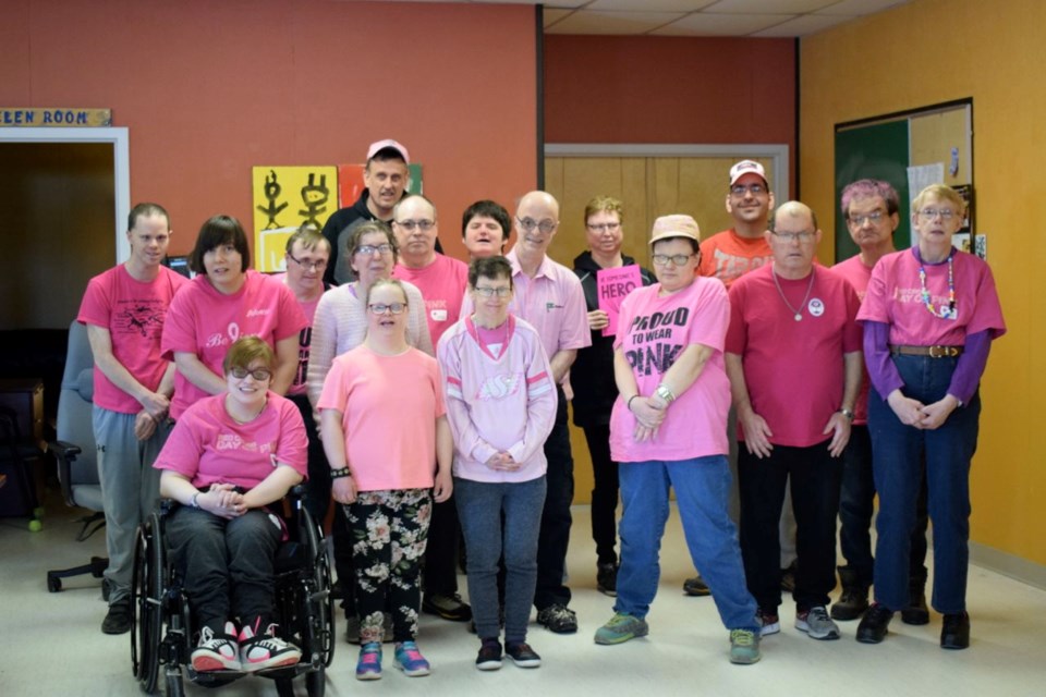 Estevan Diversified Services Pink Day participants, front row, from left, Katrina Mantei, Julia Iverson, Sherry Morden, Candace Mack, Allan Crawford, Dorothy Johner. Back row, from left, Stuart Minchin, Megan Turk, Murray Shauf, Michelle Chrest, Mark Samenook, Micheal Tymchuk, Orville Cameron, Ron Neal, Gina Parish, Darwin Styre and Grant Waldorf.