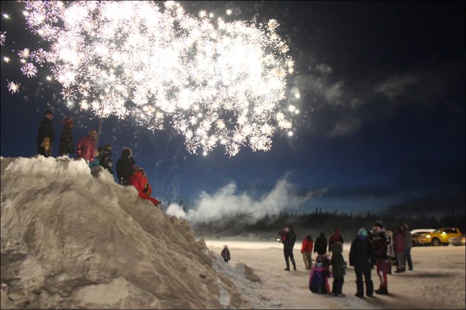 A fireworks display kicked off the Denare Beach Winter Festival on Feb. 22, bathing Shwaga Bay with light. - PHOTO BY ERIC WESTHAVER