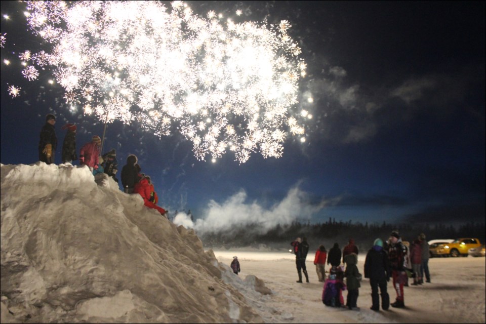 A fireworks display kicked off the Denare Beach Winter Festival on Feb. 22, bathing Shwaga Bay with light. - PHOTO BY ERIC WESTHAVER