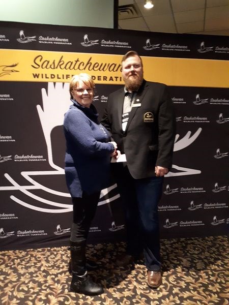 On behalf of the River Ridge branch of the Saskatchewan Wildlife Federation (SWF), Kathy Thomas, president, presented a cheque for $2,000 to Habitat Trust at the 90th annual SWF convention in Moose Jaw. Heath Dreger, past president of SWF, accepted the donation.