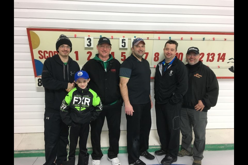 The Bob Kolodziejski foursome from Canora won the first event at the Buchanan Open/Darrell Teslia Memorial Bonspiel held from February 13 to 17. From left, were: Jacob Teslia, presenter, Jordon Zbitniff, coach, and team members Kolodziejski, John Zbitniff, Terry Wilson and Robin Ludba.