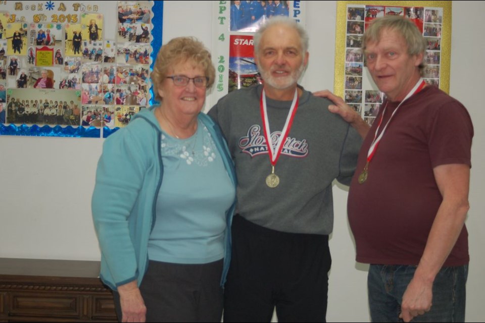 The team of Dave Weiman of Danbury and Don Sill of Sturgis won gold medals at the senior Parkland Valley District cribbage games held at the Sturgis READ Club on February 22. From left, were: Betty Lou Skogen (presenter), Weiman and Sill.
