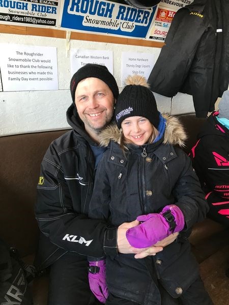 Emma Olson and her dad Greg Olson spent some outdoor fun time snowmobiling during the Roughrider Snowmobile Club annual family day.