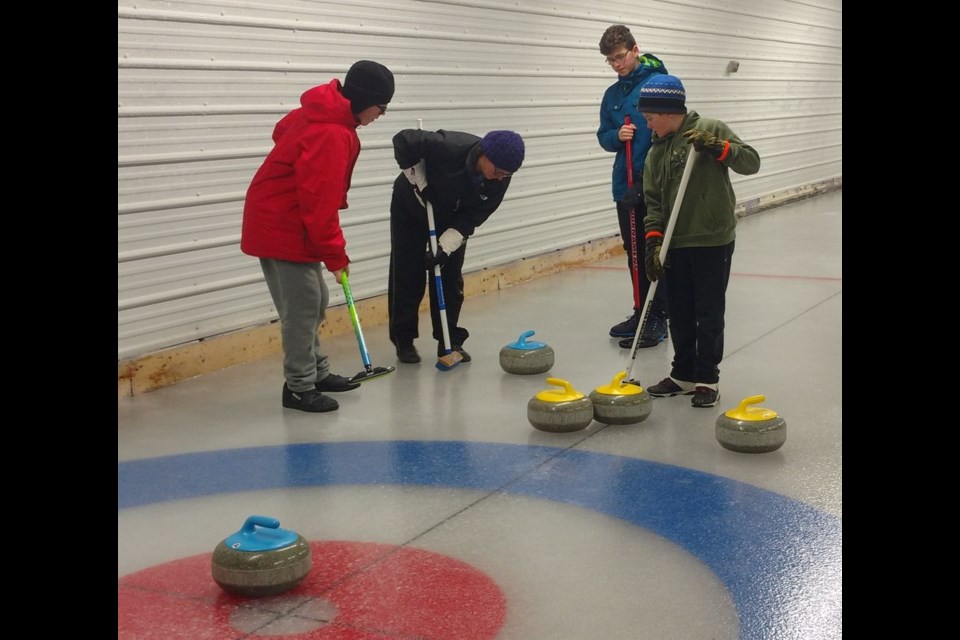 The Burback rink took part in the Togo Bonspiel from February 12 to 16, and from left, were: Zachary Burback, third (wearing red); Amanda Burback, second; Kyler Kitsch, skip, and Jacob Burback, lead.
