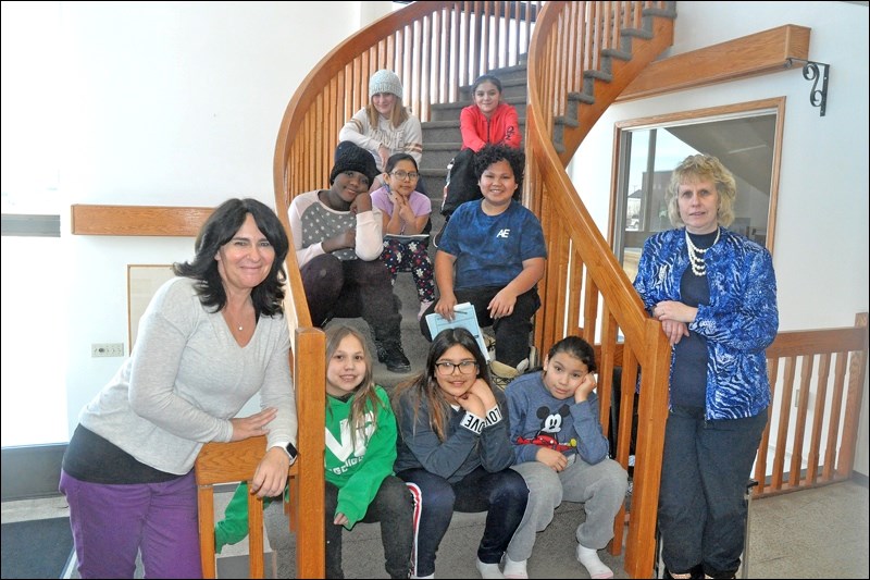 McKitrick's journalism club came to the News-Optimist office Tuesday to learn about the making of ne